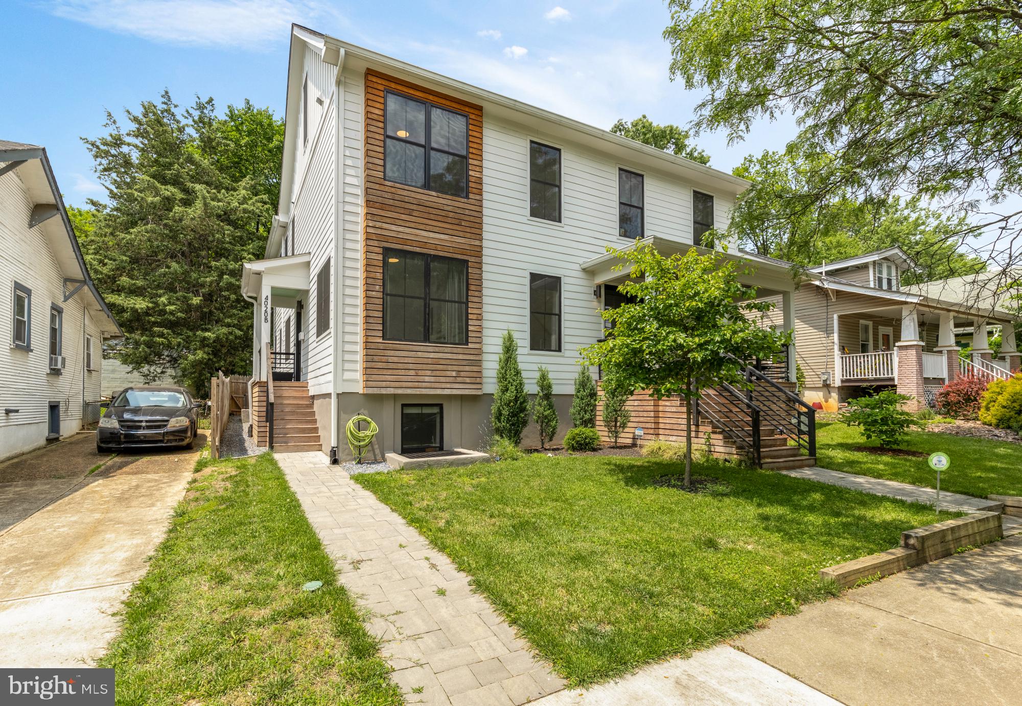 4020 35th Street, Unit B Mount Rainier, MD 20712 - Photo 38 of 42 a front view of a house with a yard