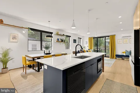 a room with pool table and windows