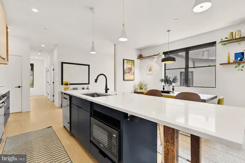 a kitchen with counter top space and sink