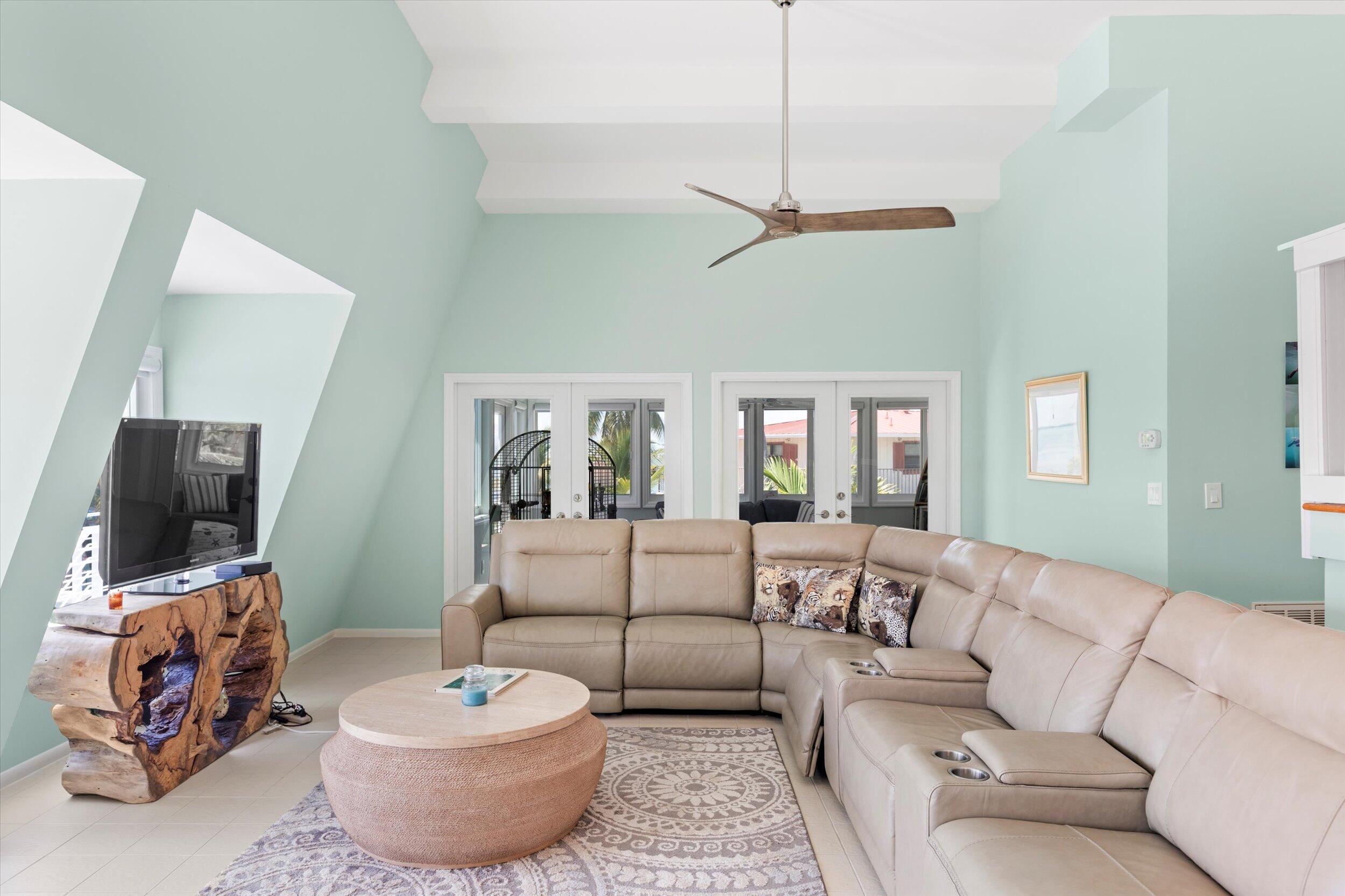 680 Cruikshank Lane Summerland Key, FL 33042 - Photo 14 of 101 a living room with furniture and a flat screen tv