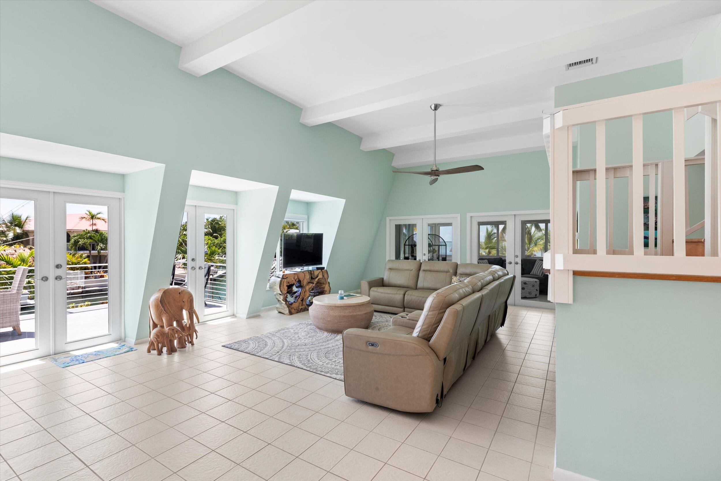 680 Cruikshank Lane Summerland Key, FL 33042 - Photo 16 of 101 a living room with furniture and a large window