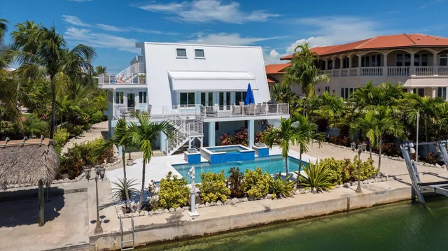 an aerial view of a house with a lake view