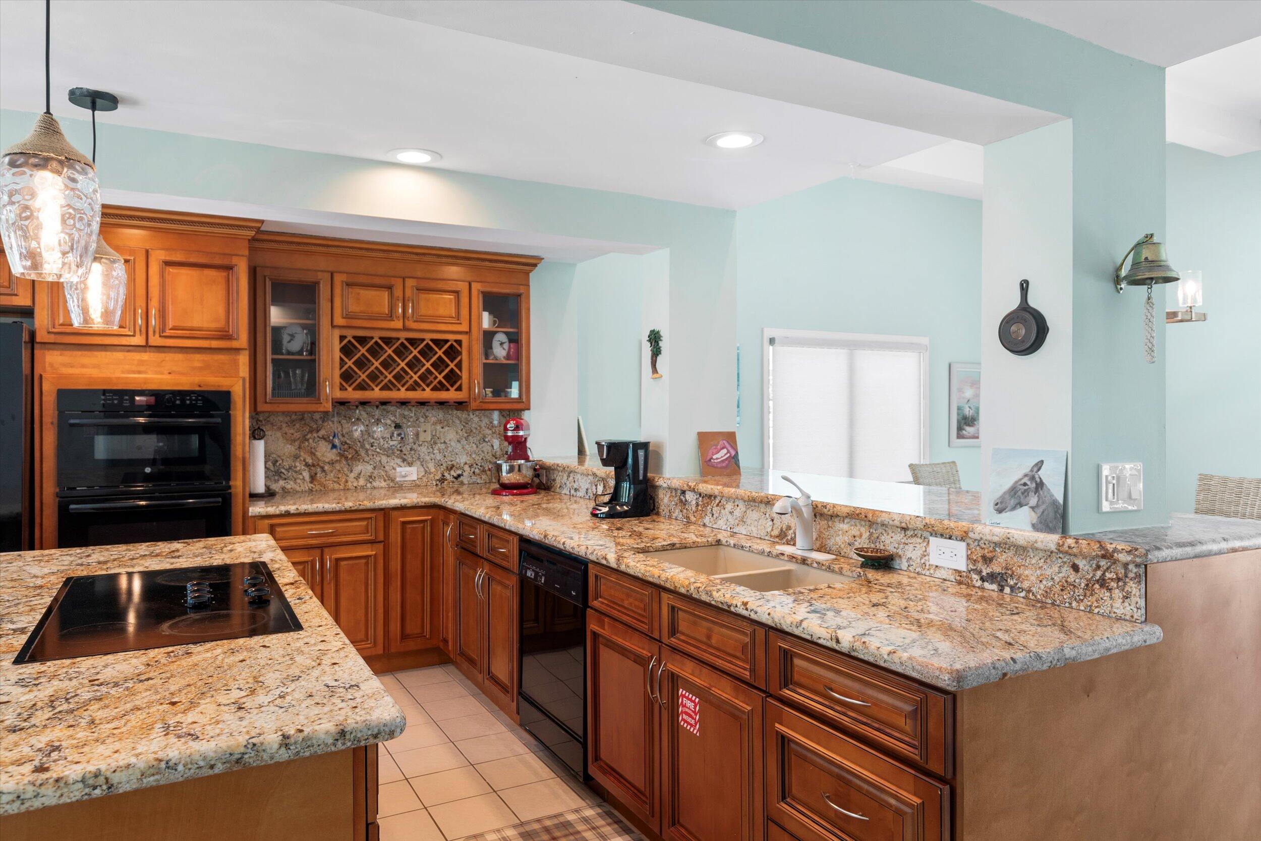 680 Cruikshank Lane Summerland Key, FL 33042 - Photo 29 of 101 a kitchen with a sink stove and cabinets