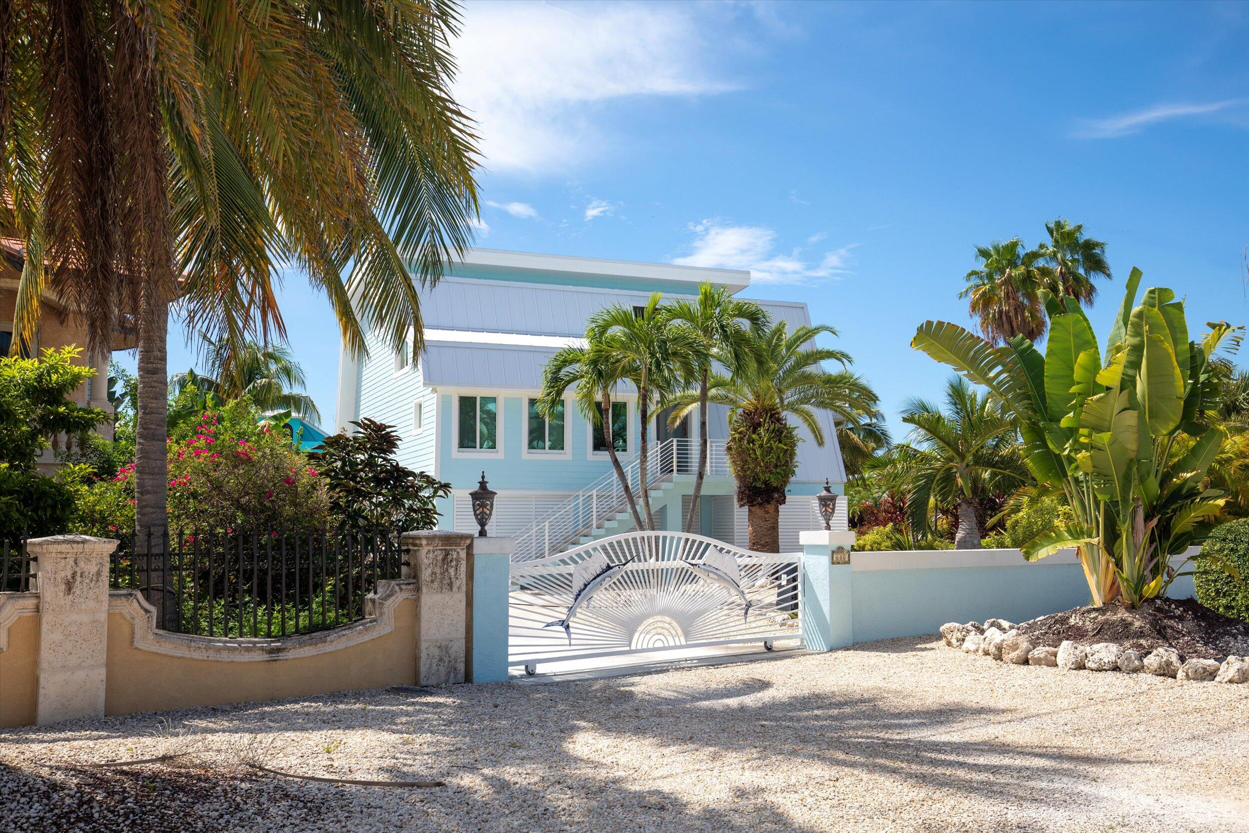 680 Cruikshank Lane Summerland Key, FL 33042 - Photo 4 of 101 a view of a water fountain with potted plants