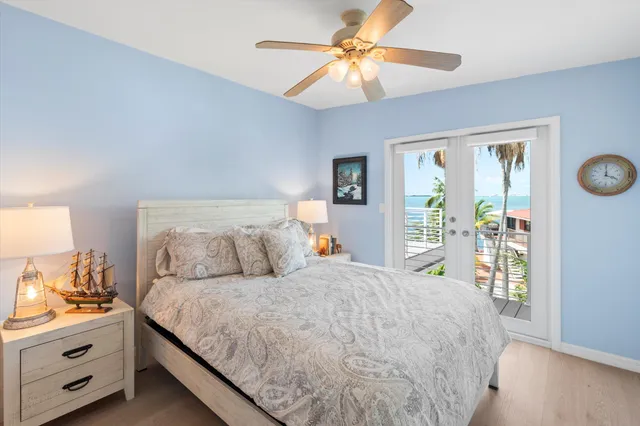 an aerial view of a house with a garden and lake view