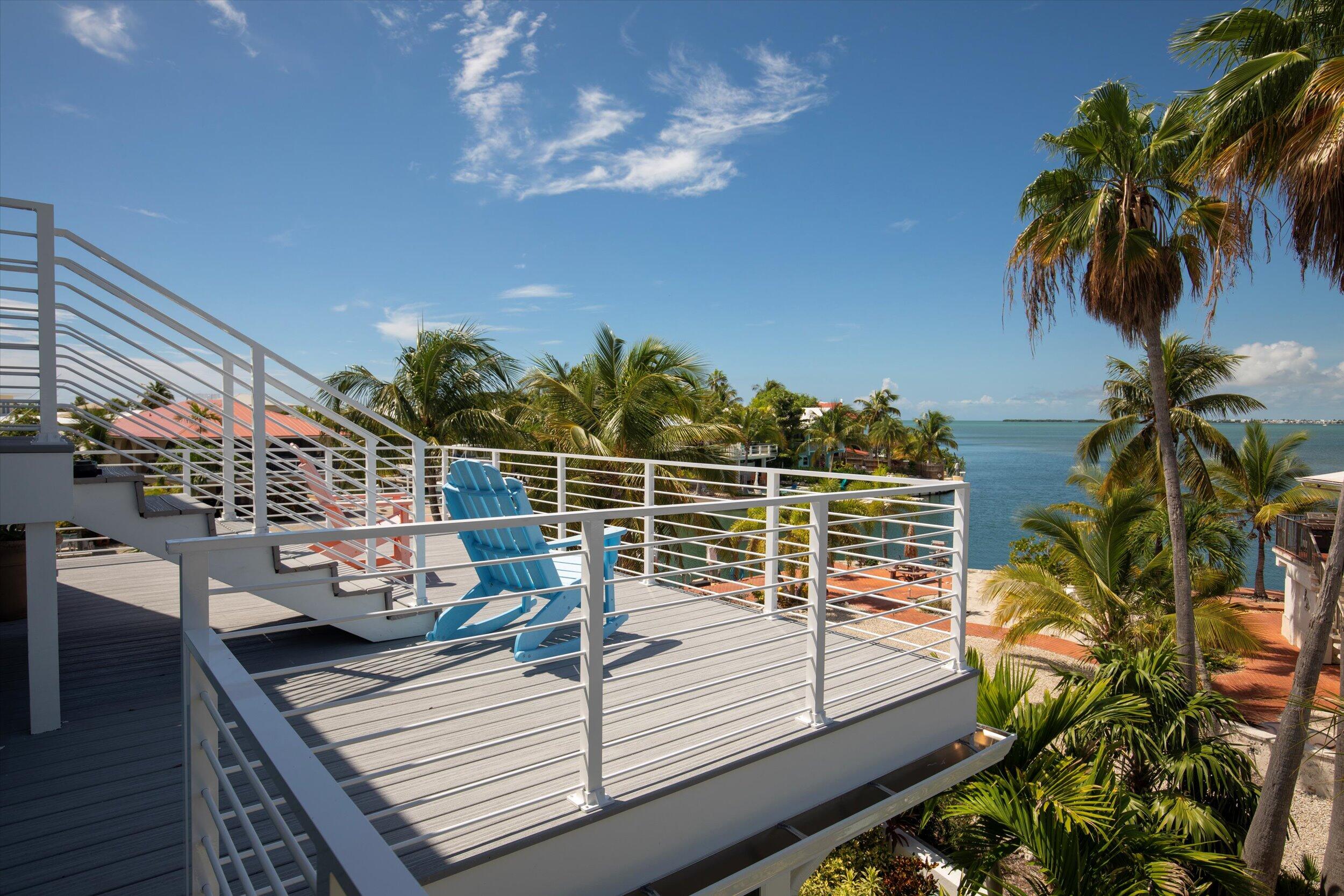 680 Cruikshank Lane Summerland Key, FL 33042 - Photo 46 of 101 a view of a balcony with potted plants