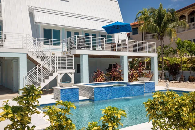 a living room with furniture and a large window with outer view