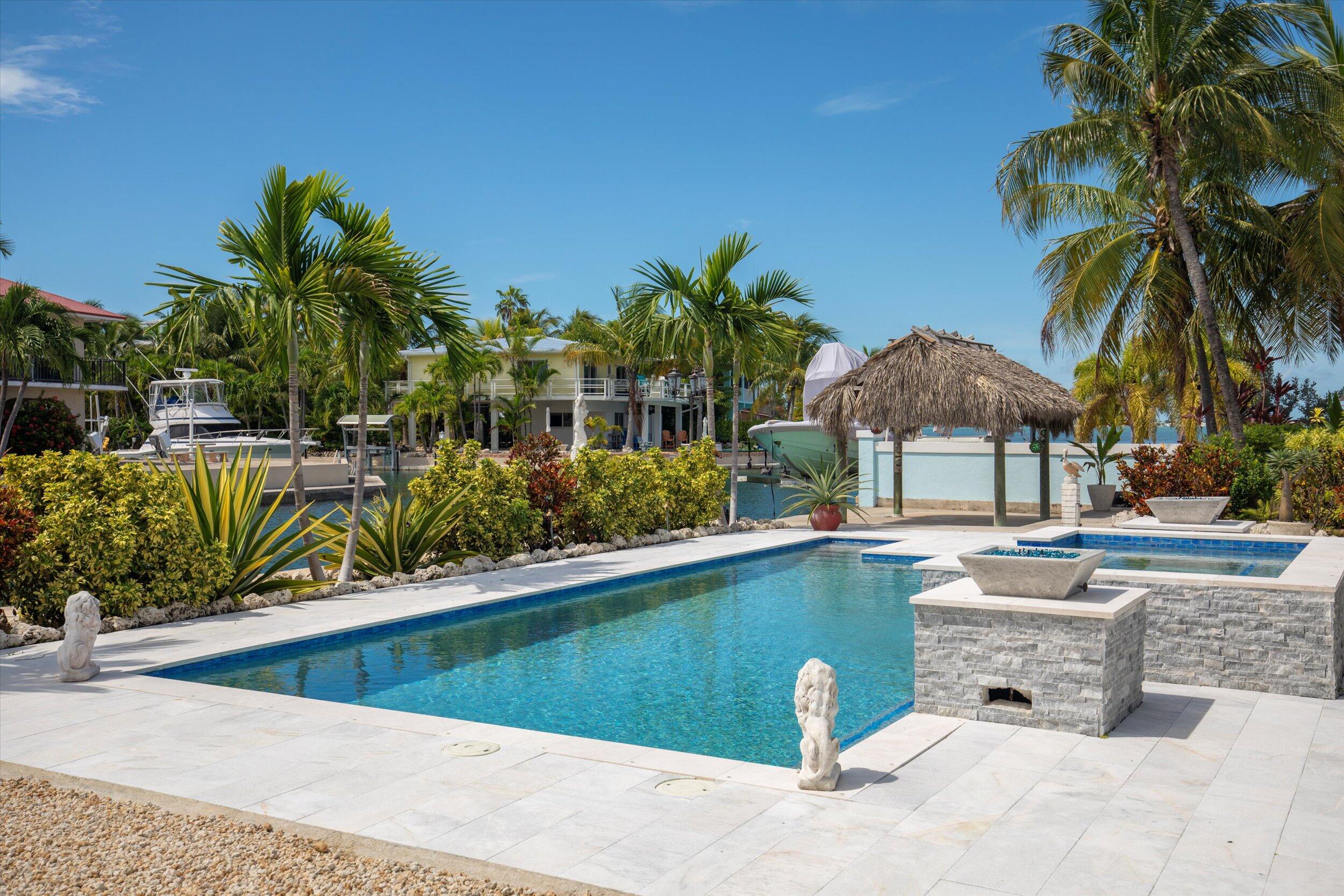 680 Cruikshank Lane Summerland Key, FL 33042 - Photo 56 of 101 a view of a swimming pool with a patio