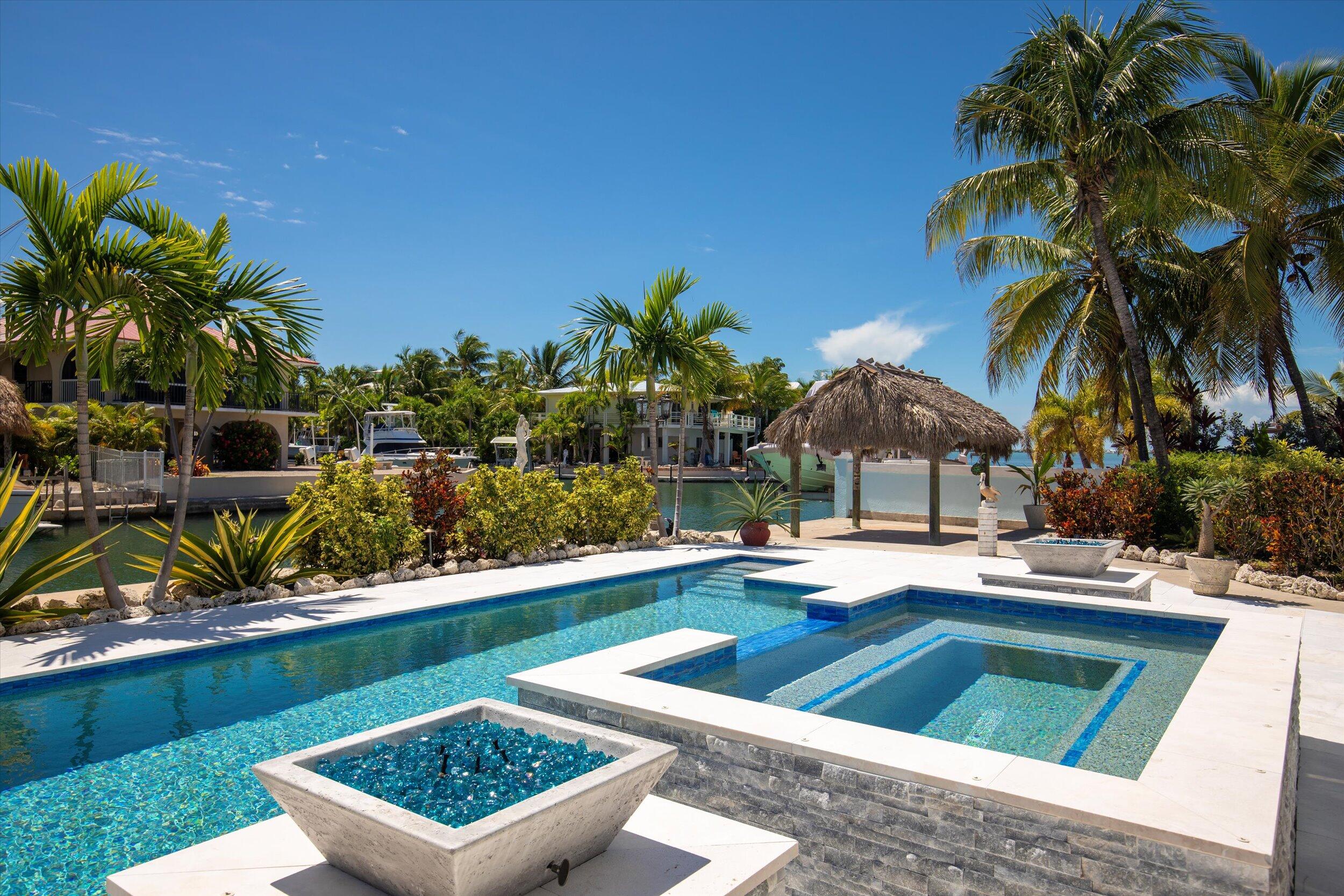 680 Cruikshank Lane Summerland Key, FL 33042 - Photo 78 of 101 a view of a backyard and swimming pool