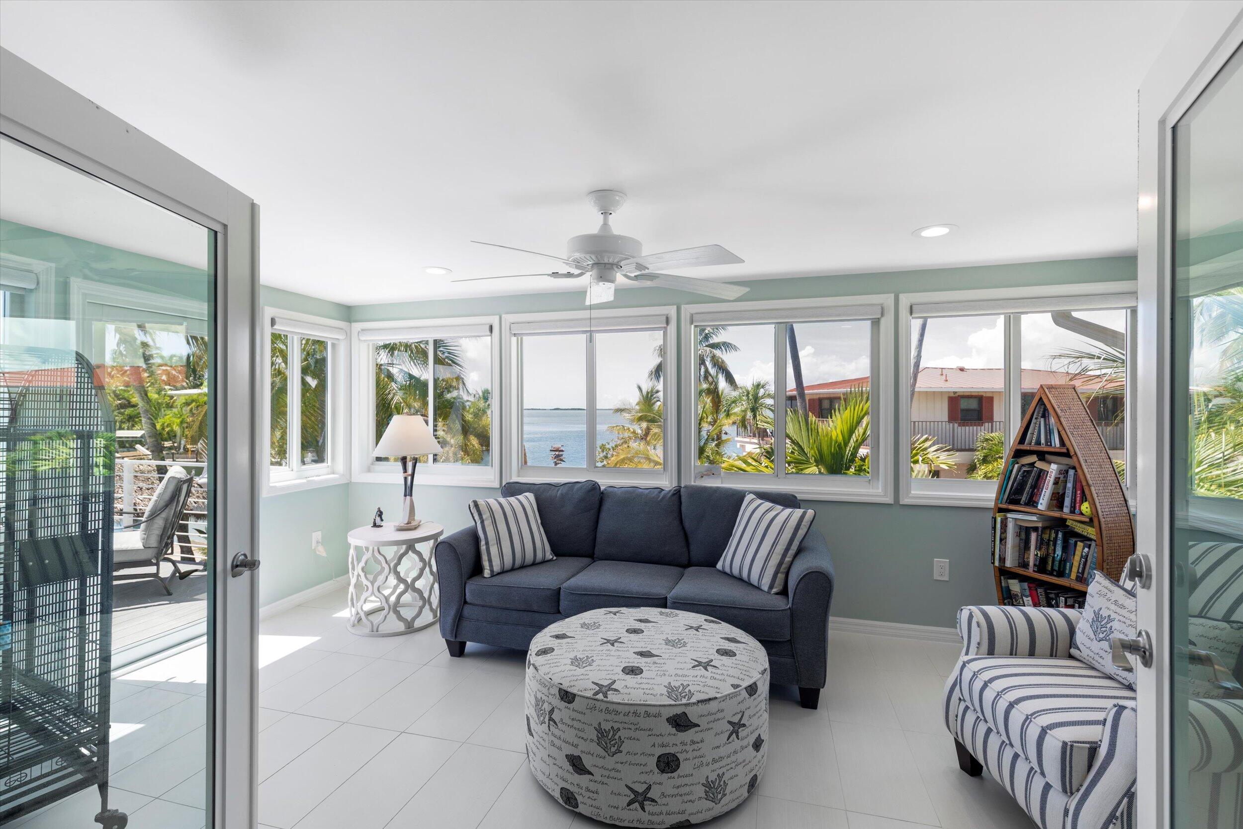 680 Cruikshank Lane Summerland Key, FL 33042 - Photo 8 of 101 a living room with furniture and a large window