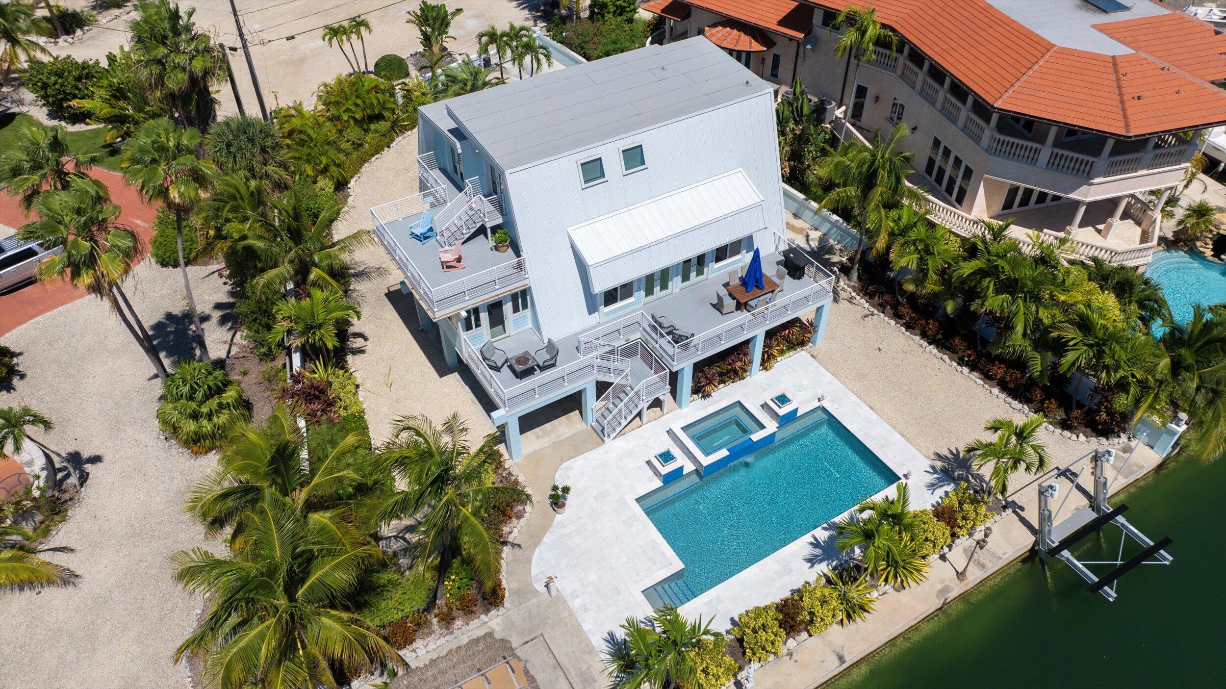680 Cruikshank Lane Summerland Key, FL 33042 - Photo 87 of 101 an aerial view of a house with a garden