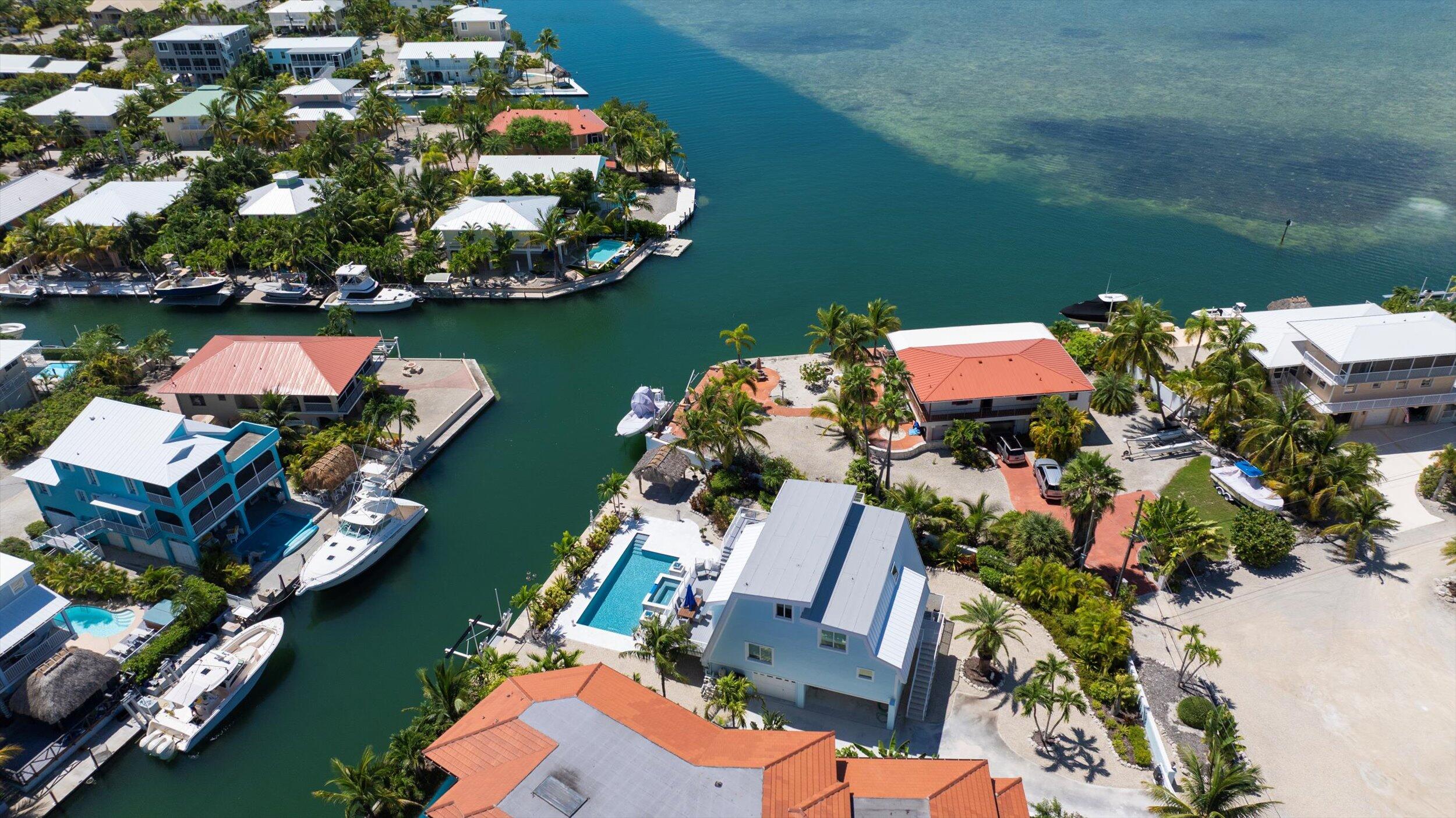 680 Cruikshank Lane Summerland Key, FL 33042 - Photo 94 of 101 an aerial view of a house swimming pool a patio and yard