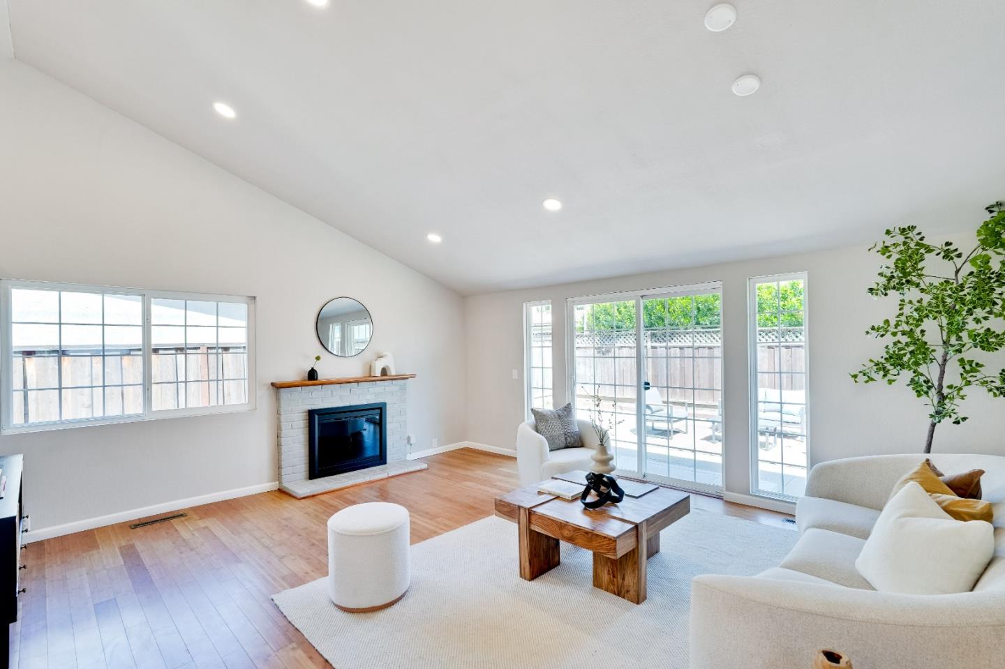 1755 Ravizza Avenue Santa Clara, CA 95051 - Photo 9 of 36 a living room with furniture fireplace and window