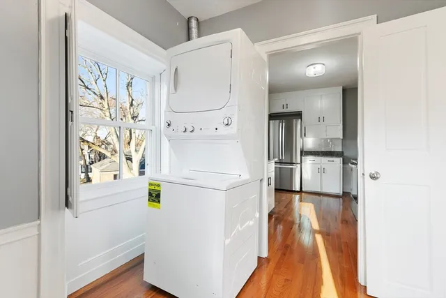 a kitchen with a refrigerator a stove and a cabinets