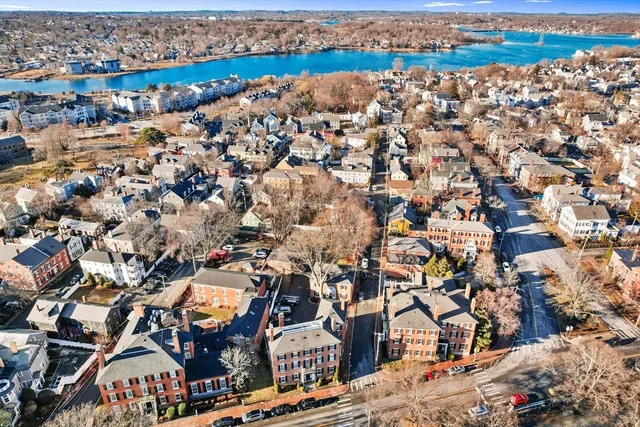 an aerial view of residential houses with city view