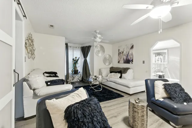 a bedroom with furniture and a chandelier