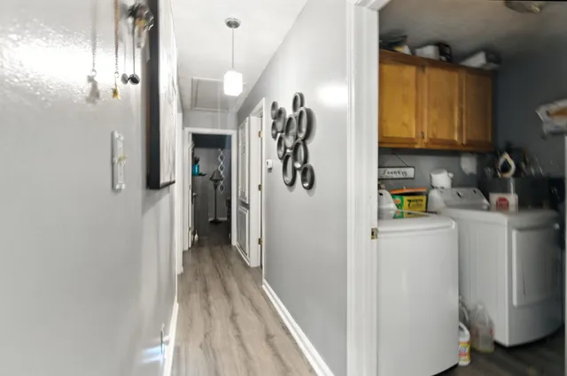 a view of hallway with washer and dryer
