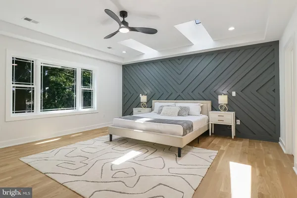 a bed room with a bed and a window