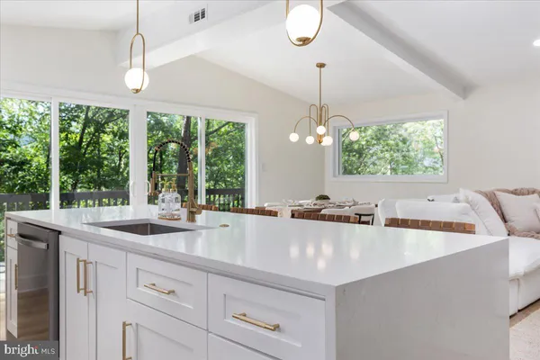 a kitchen with sink and window