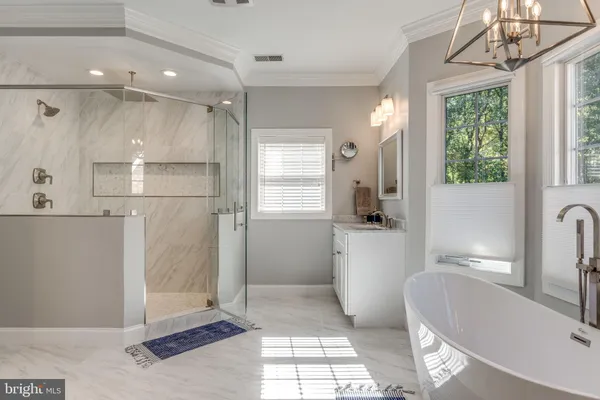 a spacious bathroom with a double vanity sink and mirror