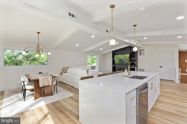 a kitchen with sink and center island