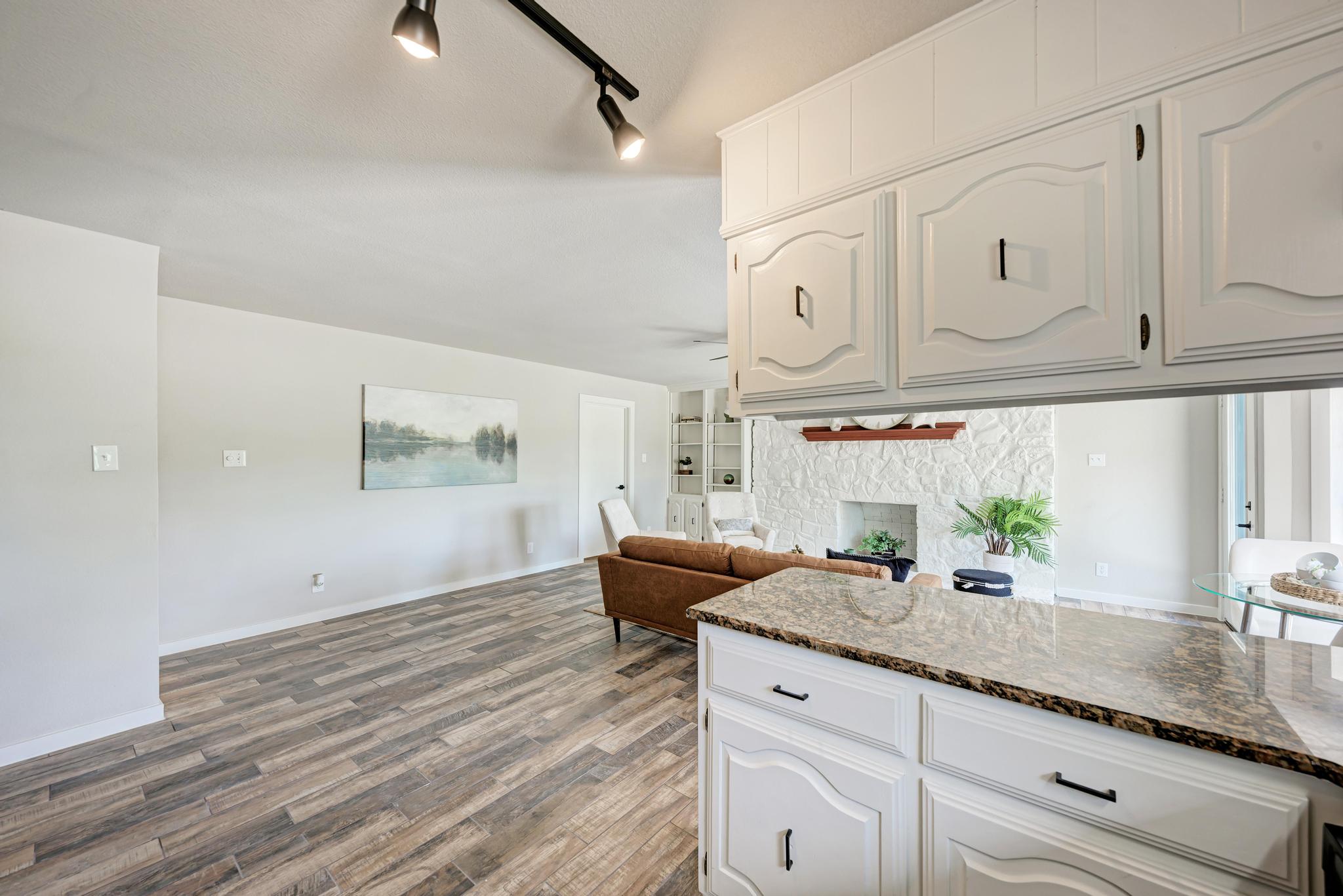 2365 Hackberry Road Salado, TX 76571 - Photo 20 of 40 a kitchen with granite countertop a sink stainless steel appliances and cabinets