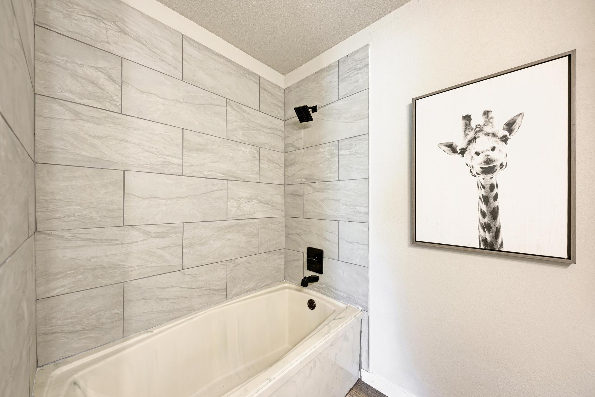 2365 Hackberry Road Salado, TX 76571 - Photo 29 of 40 a bathroom with a bathtub and shower