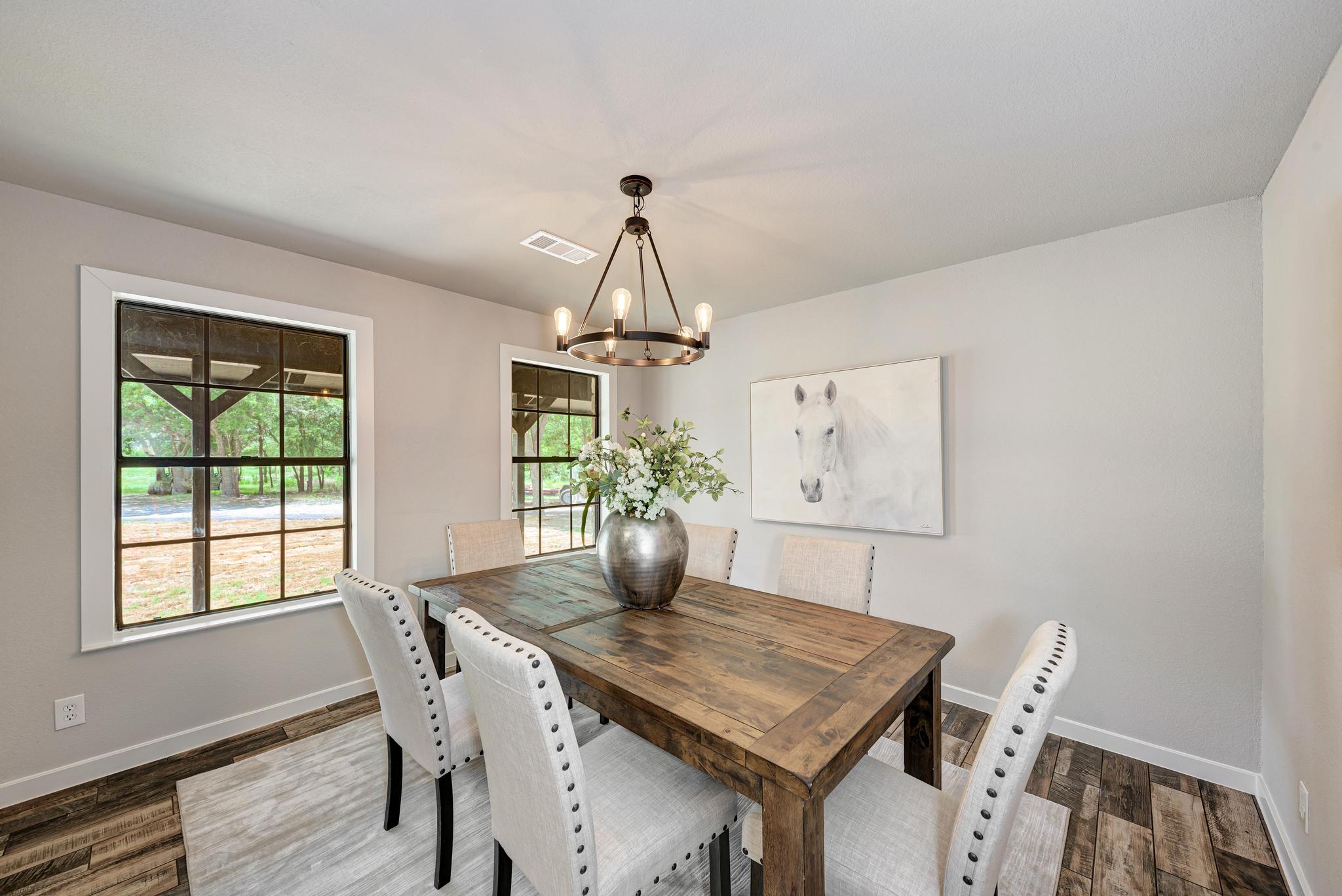2365 Hackberry Road Salado, TX 76571 - Photo 5 of 40 a view of a dining room with furniture window and wooden floor