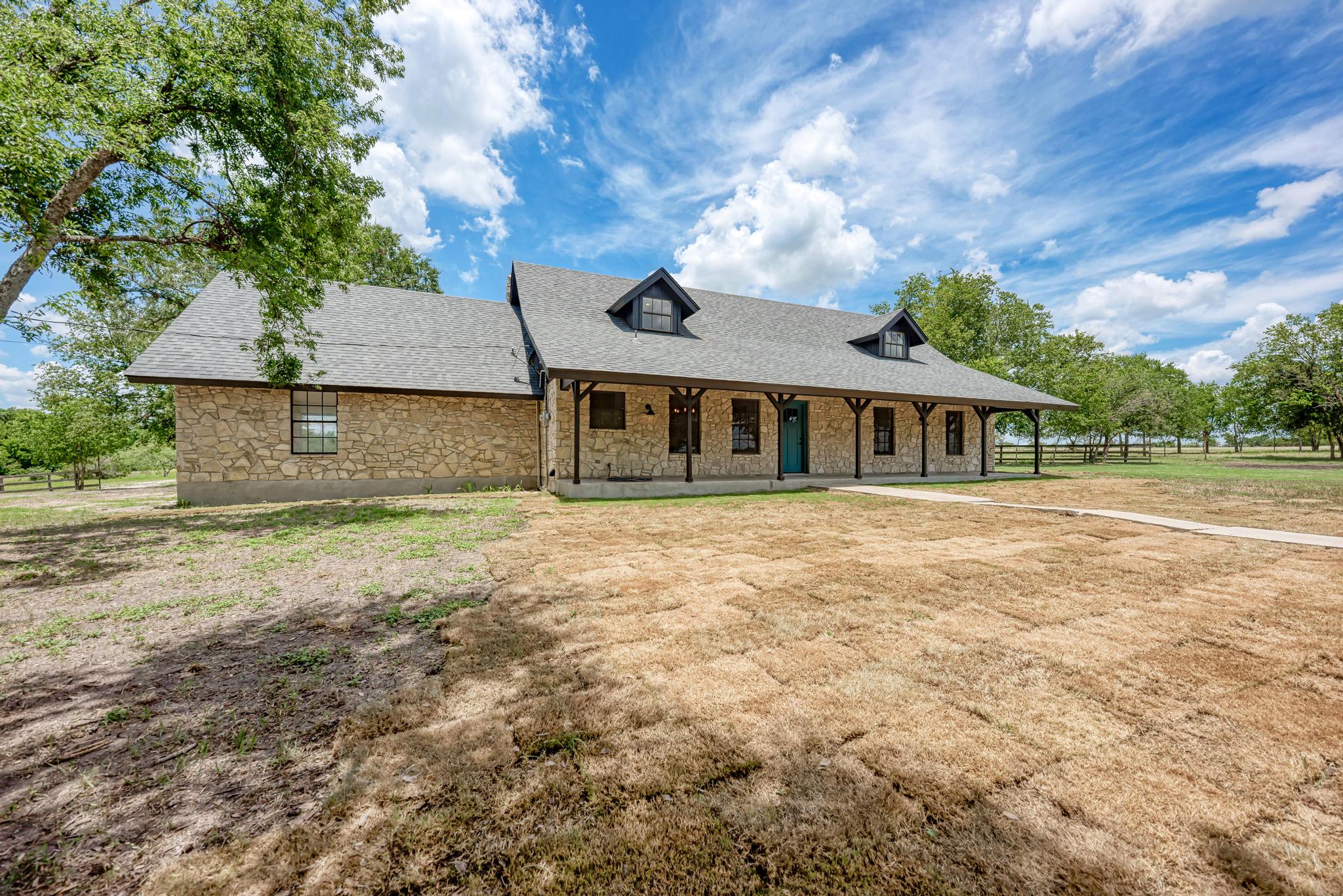 2365 Hackberry Road Salado, TX 76571 - Photo 9 of 40 a front view of a house with a garden