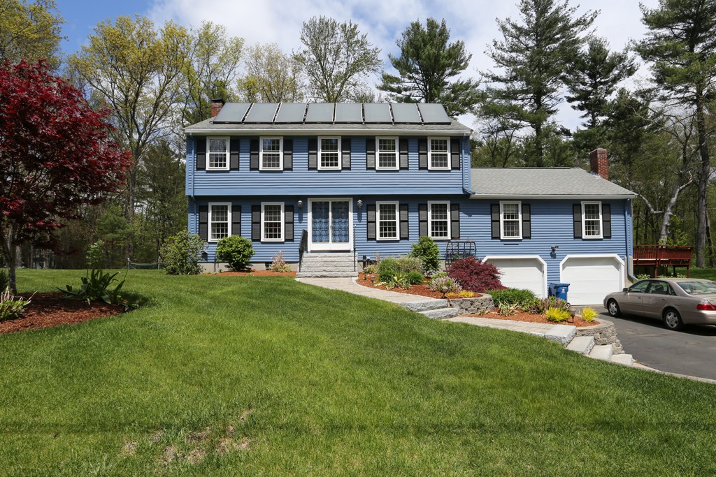 28 Middle Road Sudbury, MA 01776 - Photo 1 of 24 a front view of a house with a yard table and chairs