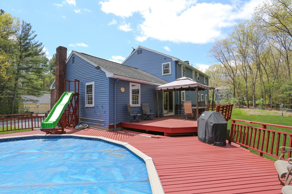 28 Middle Road Sudbury, MA 01776 - Photo 4 of 24 a view of a house with backyard and sitting area