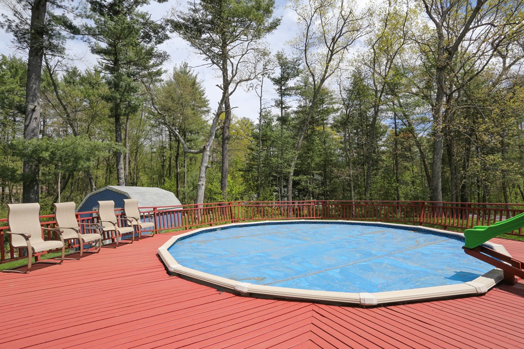 28 Middle Road Sudbury, MA 01776 - Photo 5 of 24 a view of a swimming pool with a patio