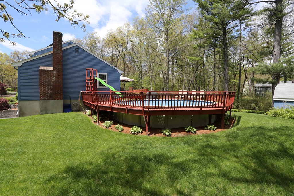 28 Middle Road Sudbury, MA 01776 - Photo 7 of 24 a front view of a house with garden and deck