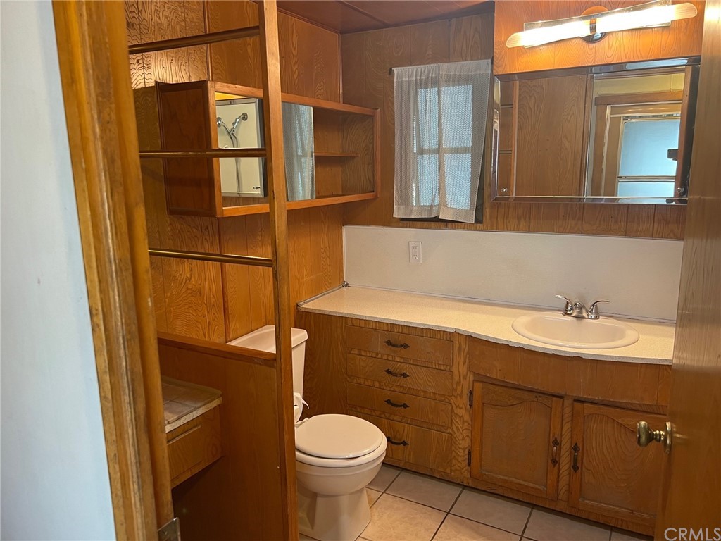 13645 5th Street, Unit 35 Yucaipa, CA 92399 - Photo 11 of 22 a bathroom with a sink a toilet and shower