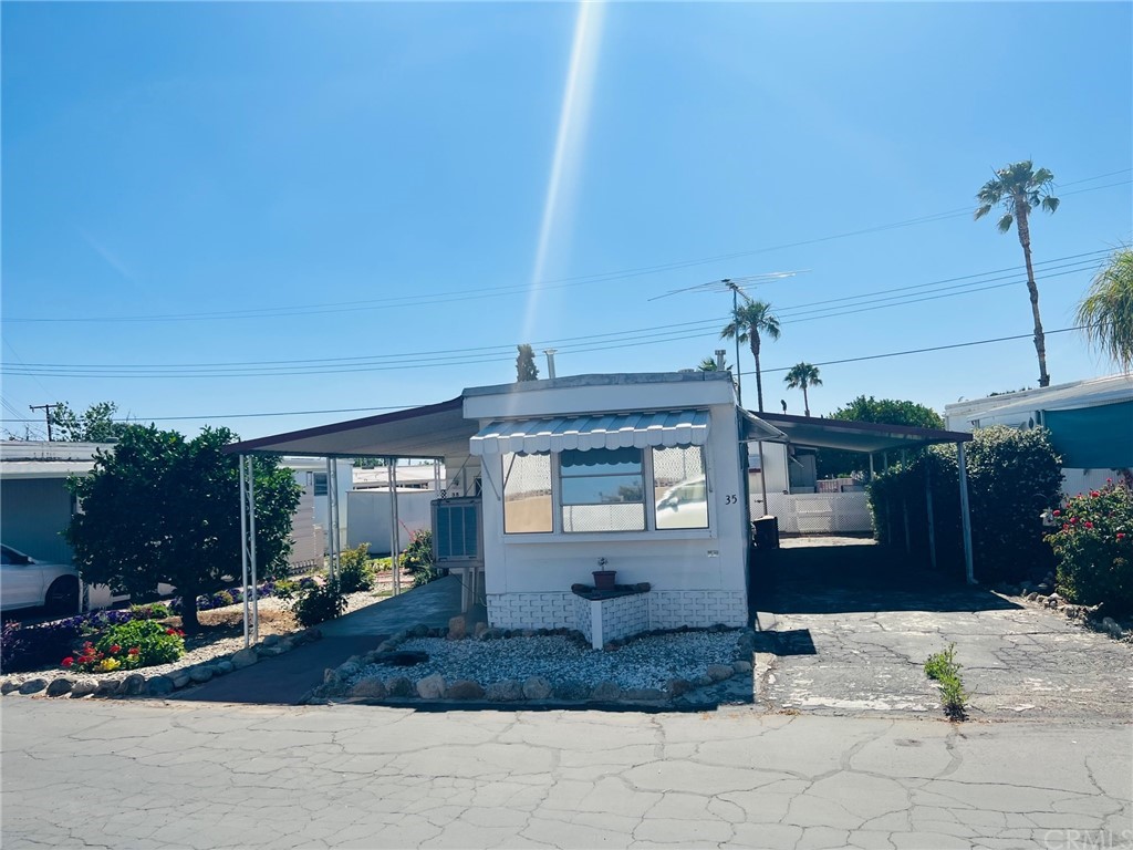 13645 5th Street, Unit 35 Yucaipa, CA 92399 - Photo 2 of 22 a view of a house with a patio