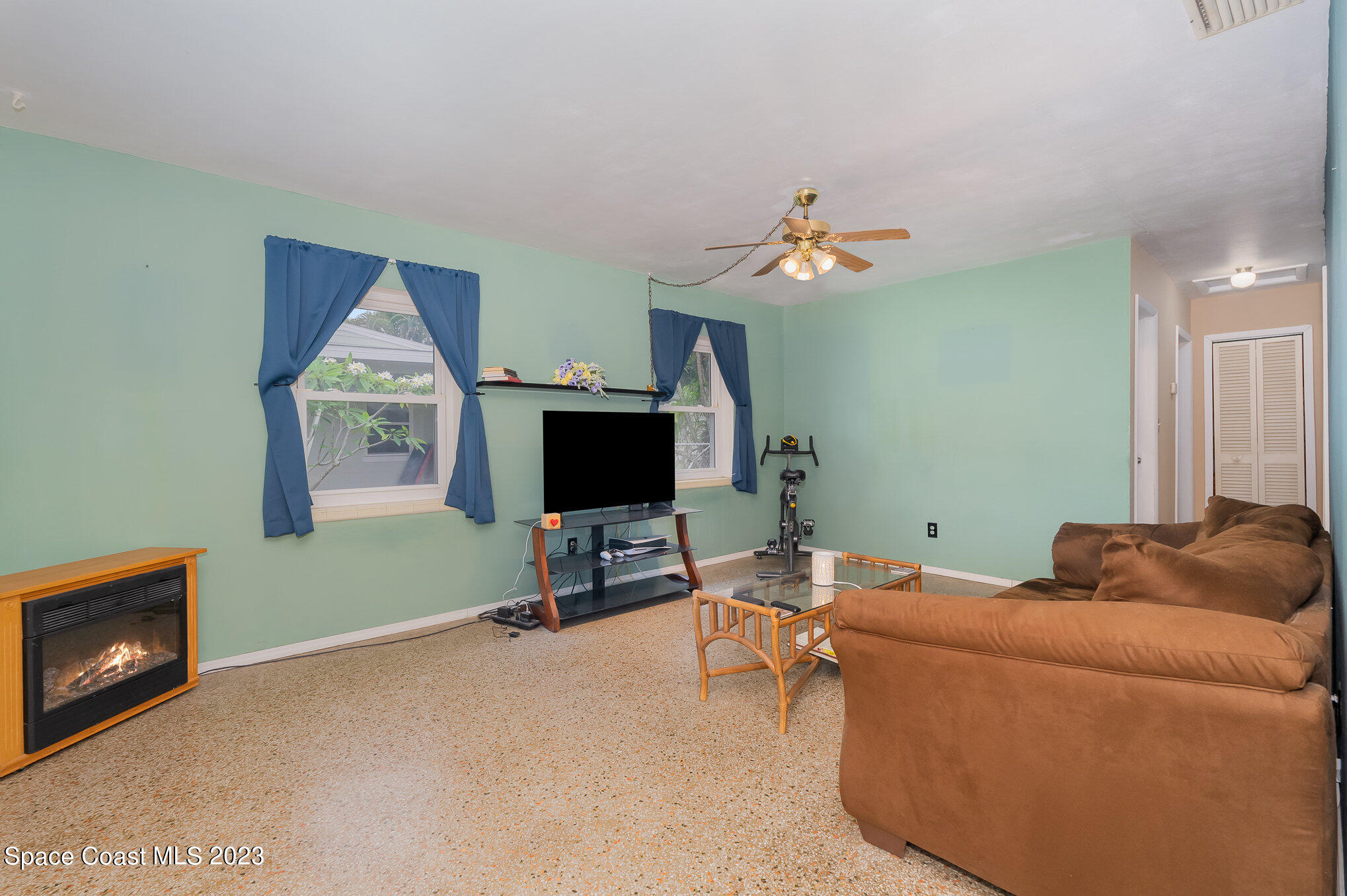 109 Cherry Street Melbourne, FL 32901 - Photo 4 of 31 a living room with furniture and a flat screen tv