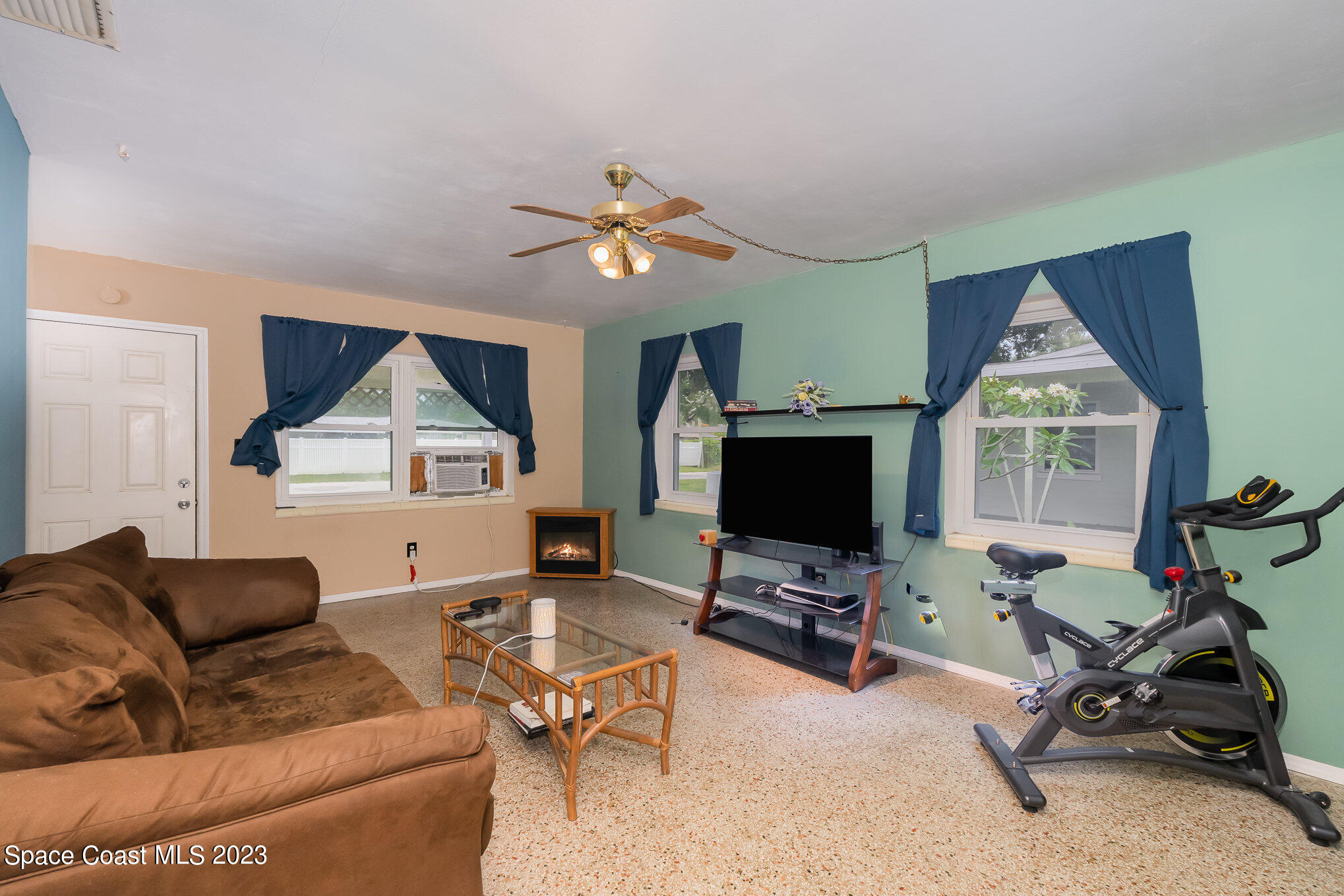 109 Cherry Street Melbourne, FL 32901 - Photo 5 of 31 a living room with furniture and a flat screen tv