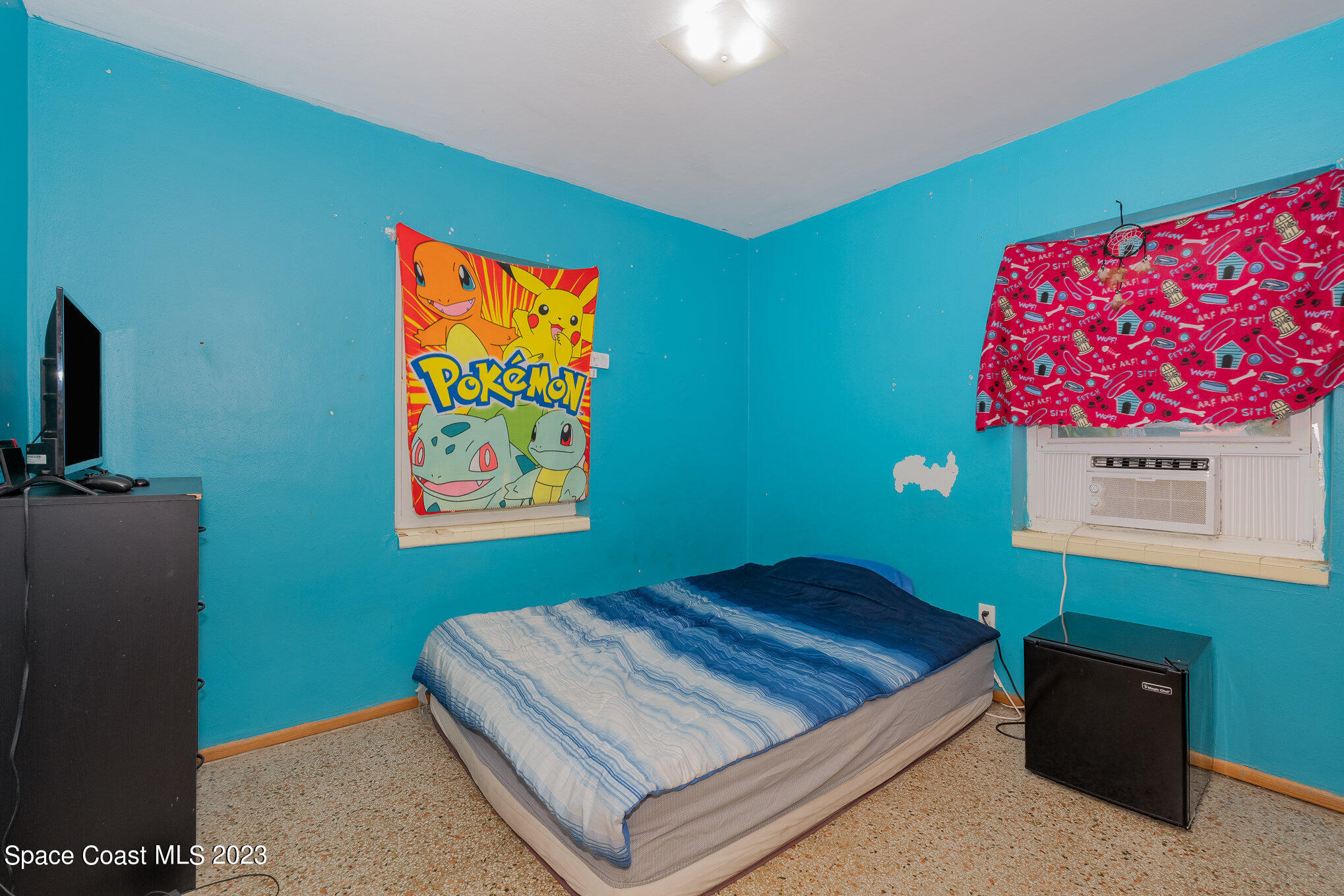 109 Cherry Street Melbourne, FL 32901 - Photo 10 of 31 a room with a bed and a television