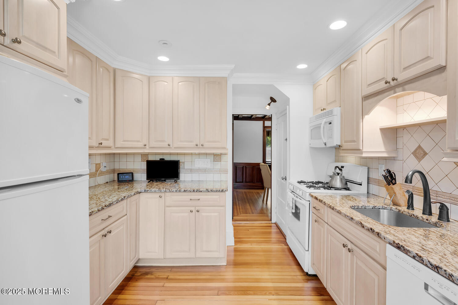 120 Bowne Road Middletown, NJ 07716 - Photo 12 of 25 a kitchen with white cabinets sink and white appliances