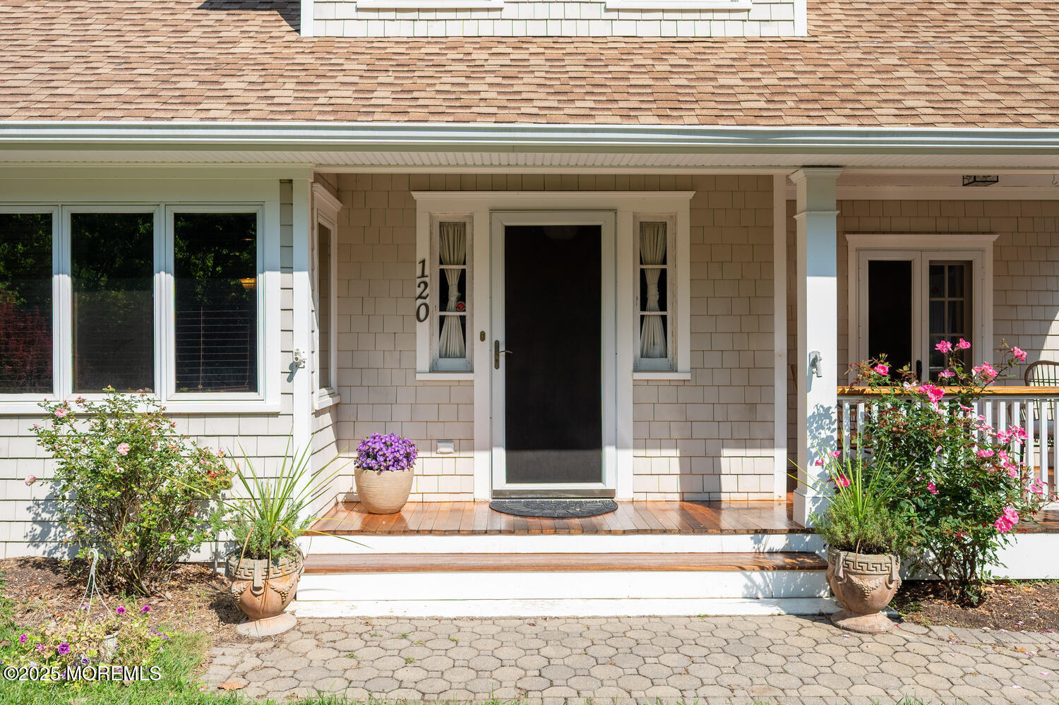 120 Bowne Road Middletown, NJ 07716 - Photo 2 of 25 a view of a brick house with potted plants