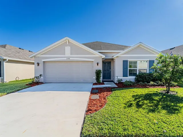 a front view of a house with yard