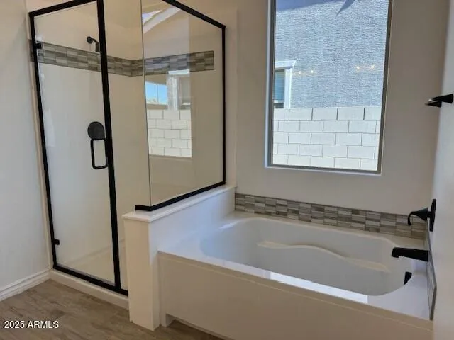 a bathroom with a double vanity sink and mirror with shower