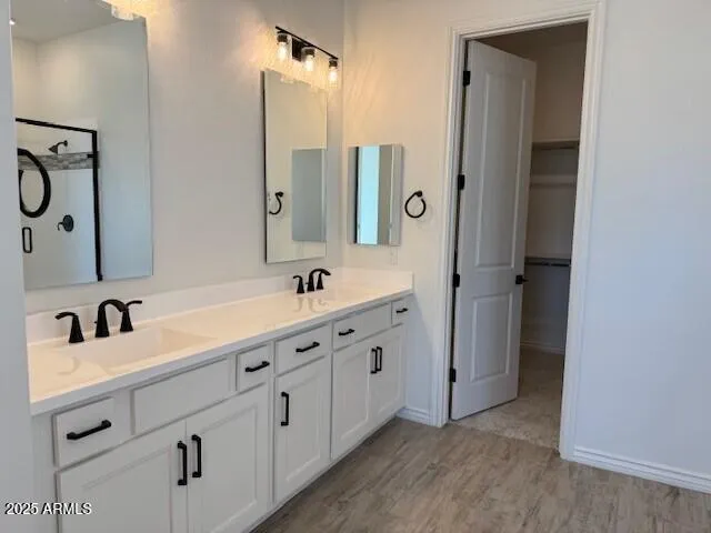 a view of empty room with wooden floor and windows