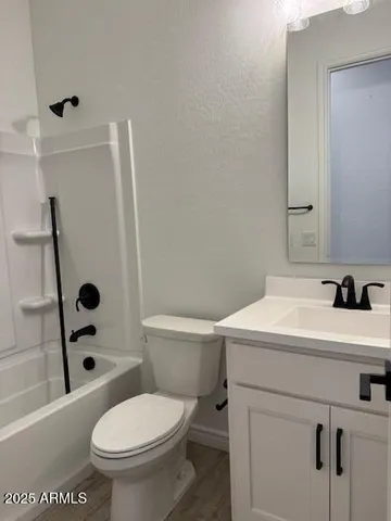 a bathroom with a sink a toilet and a tub