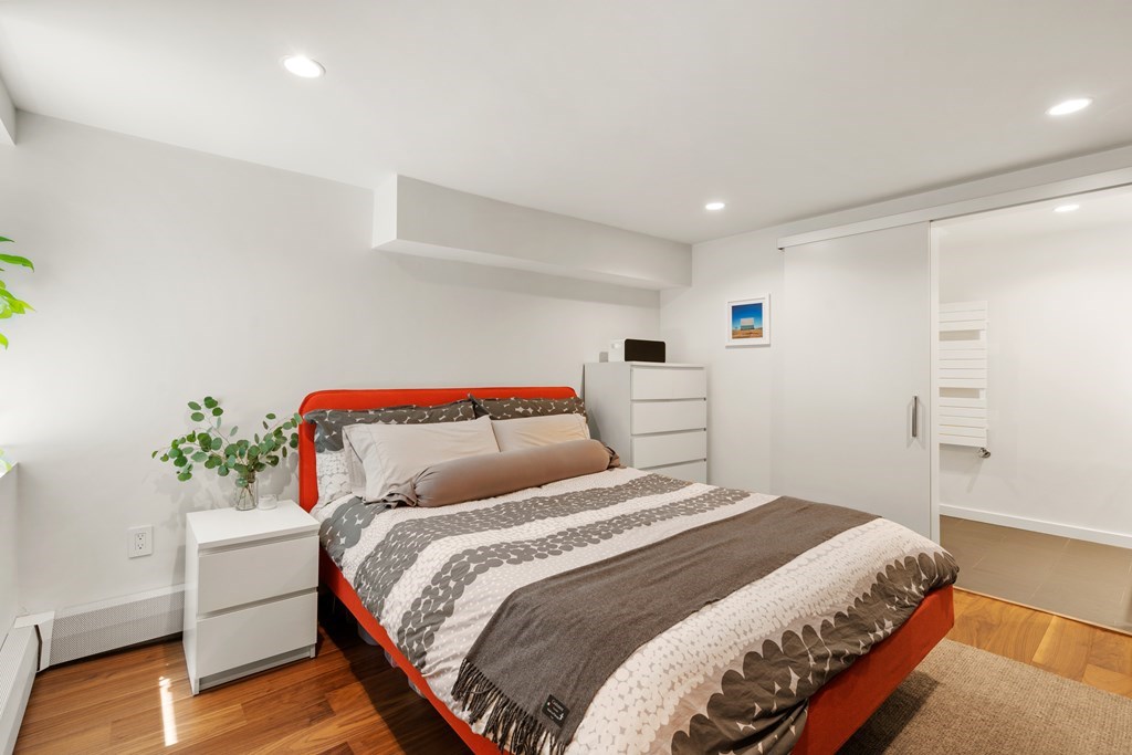 5 Auburn Street, Unit 1 Boston, MA 02129 - Photo 12 of 25 a bedroom with a bed and a potted plant