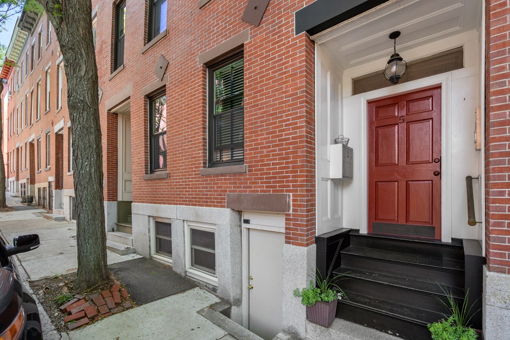 5 Auburn Street, Unit 1 Boston, MA 02129 - Photo 25 of 25 a front view of a house with a garden
