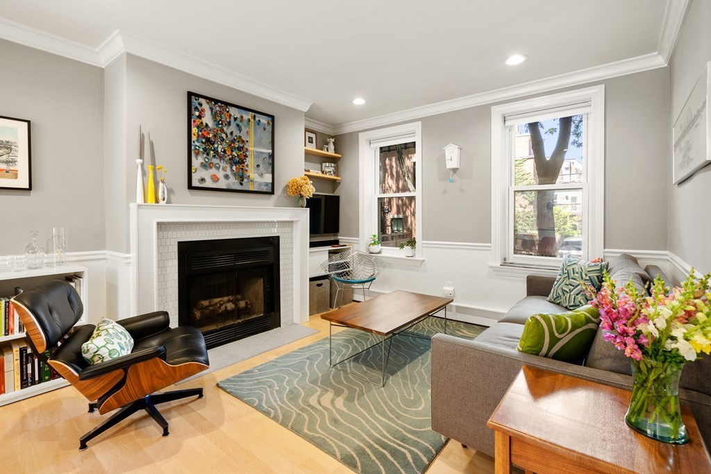 5 Auburn Street, Unit 1 Boston, MA 02129 - Photo 7 of 25 a living room with furniture and a fireplace