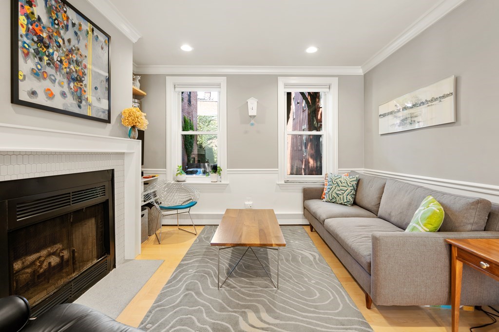 5 Auburn Street, Unit 1 Boston, MA 02129 - Photo 8 of 25 a living room with furniture and a fireplace
