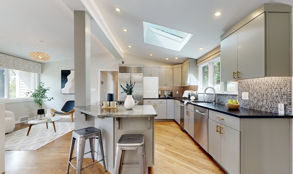 16 Marshall Road Winchester, MA 01890 - Photo 1 of 42 a kitchen with stainless steel appliances kitchen island granite countertop a sink and cabinets