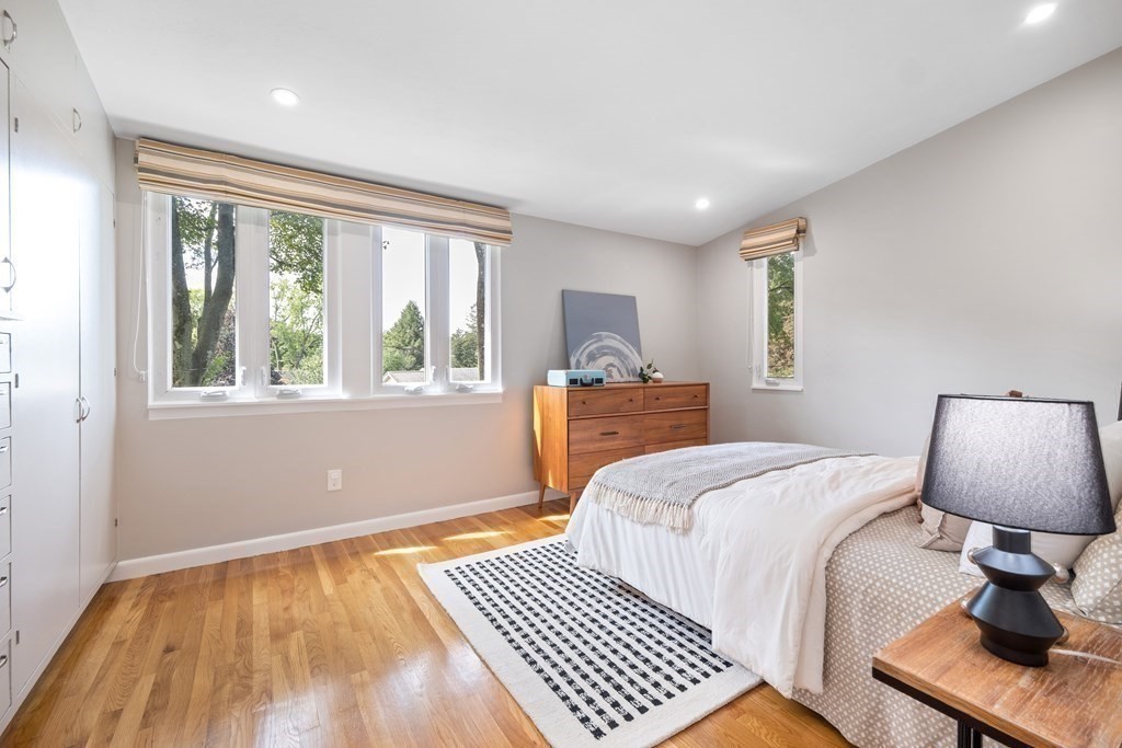 16 Marshall Road Winchester, MA 01890 - Photo 14 of 42 a bedroom with a bed lamp on table and a window